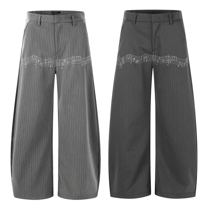 Front and back views of gray pinstripe wide-leg trousers with white music note embroidery