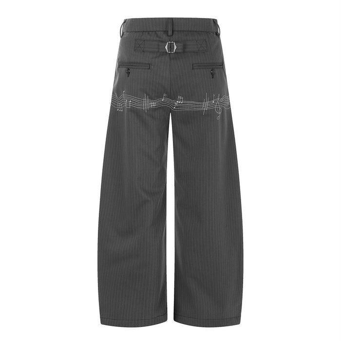 Back view of gray pinstripe wide-leg trousers with rear pockets and music note embroidery