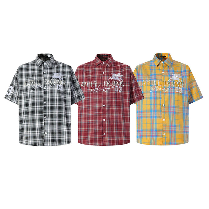 Three plaid short-sleeve shirts in black, red, and yellow with embroidered Pegasus and studded lettering