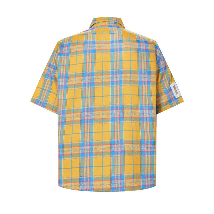 Back view of yellow plaid short-sleeve shirt with blue lines and white sleeve number patch