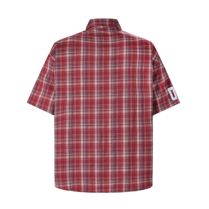 Back view of red plaid short-sleeve shirt with white sleeve number patch