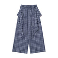 Navy plaid wide-leg pants with apron-style front overlay, front view