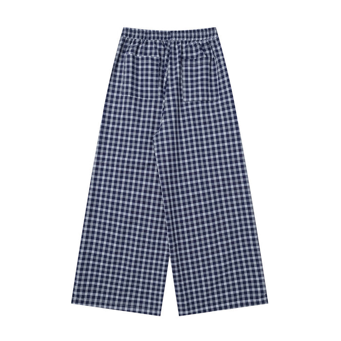 Back view of navy plaid wide-leg pants with elastic waistband and patch pockets