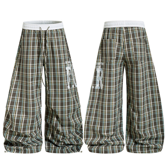 Plaid wide-leg parachute pants shown front and back with white elastic waistband