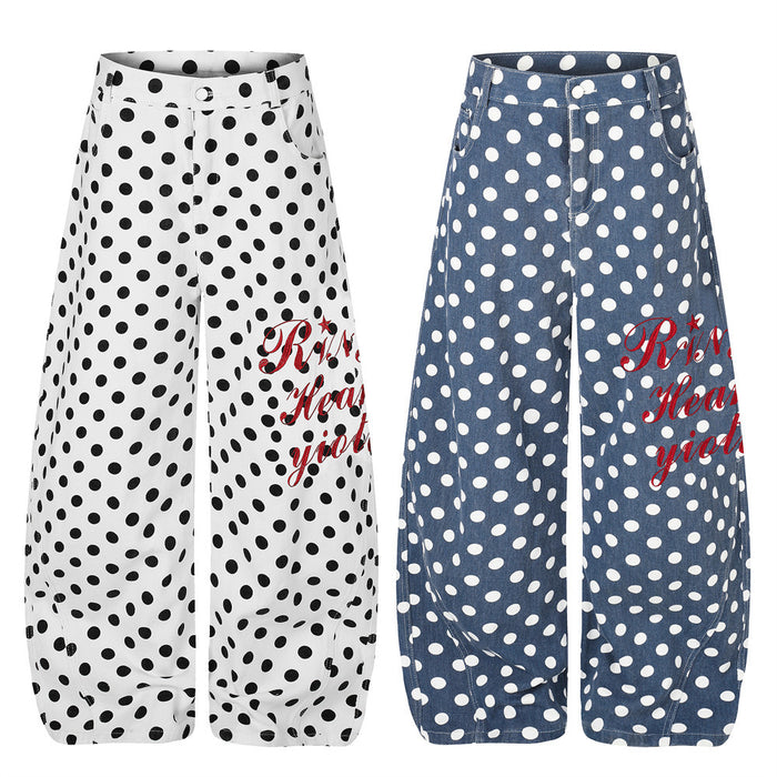 Wide-leg polka dot pants shown in white and blue colorways with curved hems and red script graphics