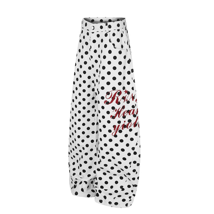 White wide-leg pants with black polka dots, front pockets, curved hems, and red script graphic