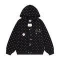Black polka dot zip-up hoodie front with raised cat patch and colorful star embroidery
