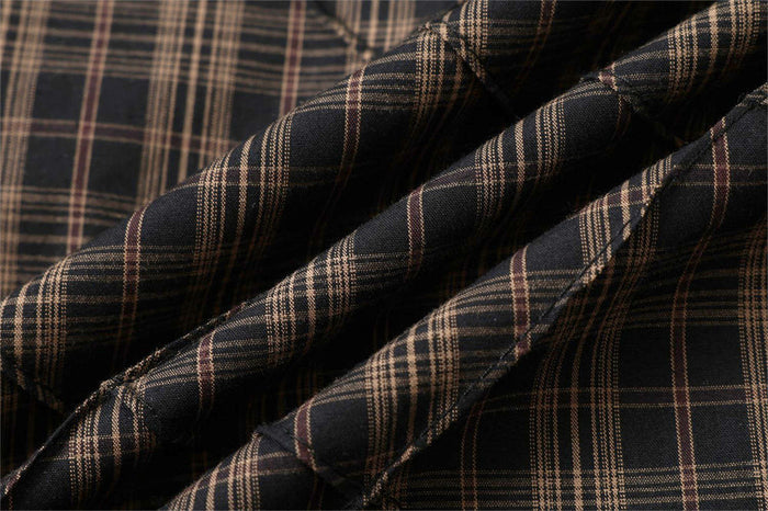 Folded plaid fabric texture with diagonal quilted seams