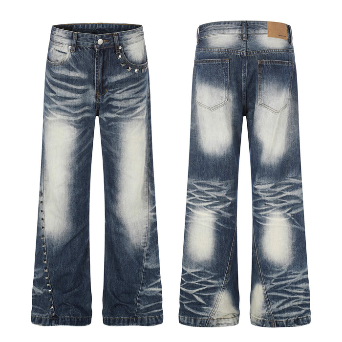Front and back view of Omirad studded vintage wash jeans with pyramid stud side seams and heavy whisker fade denim