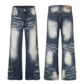 Front and back view of Omirad studded vintage wash jeans with pyramid stud side seams and heavy whisker fade denim