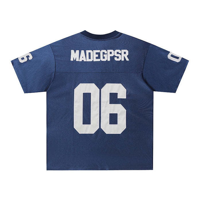 Blue retro football jersey tee with oversized white 06 number and varsity-style MADEGPSR lettering on the back