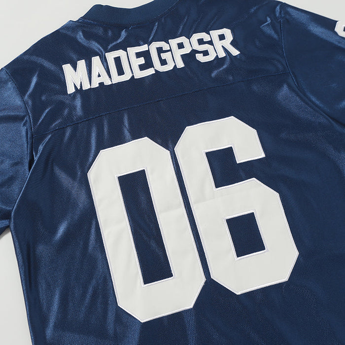 Navy retro football jersey tee with white varsity number 06 and bold MADEGPSR lettering on the back