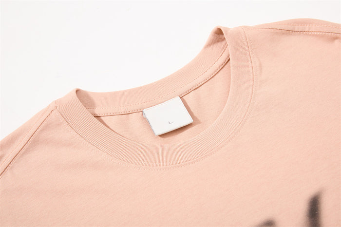 Close-up of beige crew neck and shoulder seam on sleeveless tank top