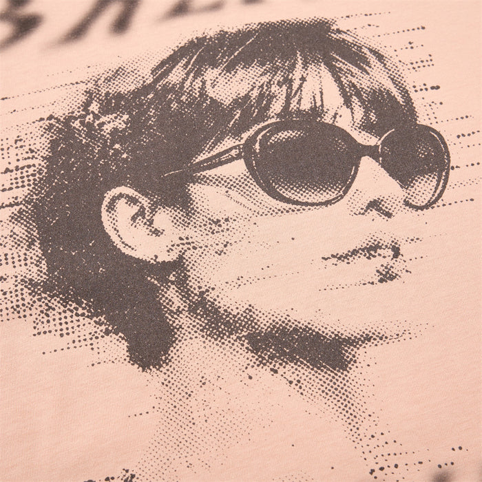 Close-up of retro portrait print with sunglasses on beige tank top