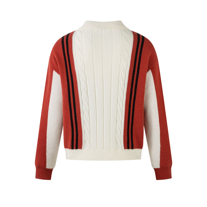 Back view of cream cable-knit zip jacket with red sleeves and black stripe panels