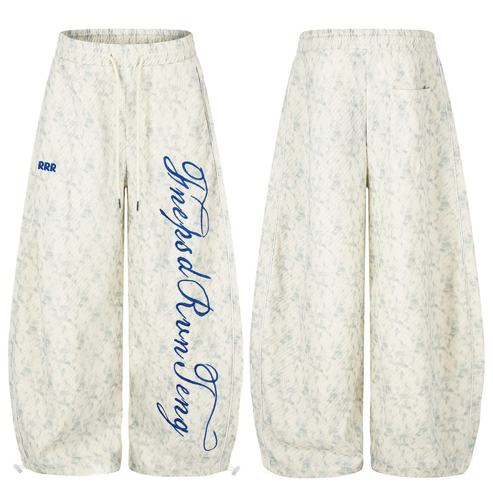 Front and back view of acid wash wide-leg sweatpants with blue RRR and script embroidery