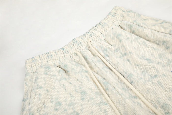 Close-up of elastic waistband and drawstring on acid wash sweatpants