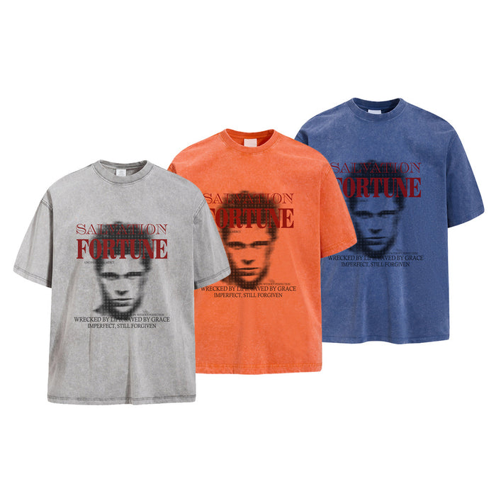 Three acid wash oversized graphic T-shirts in gray, orange, and blue