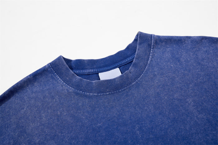 Blue crew neck collar close-up on acid wash T-shirt