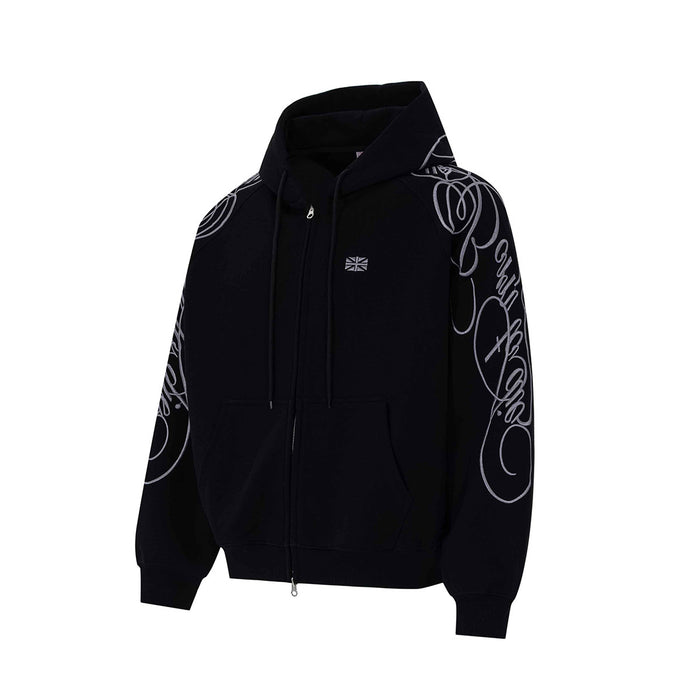 Black zip-up hoodie shown from an angled front view with white script embroidery along the sleeves