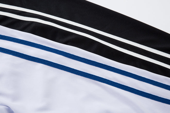 Close-up of shoulder stripes on white and black pinstripe football jersey sleeves