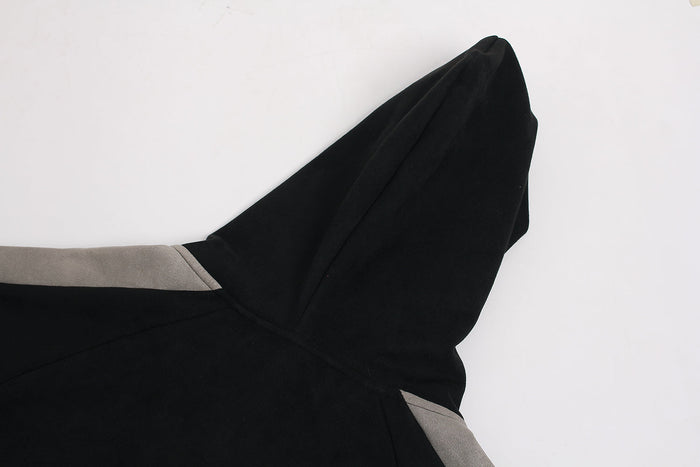 Close-up of black hood and gray shoulder panel on suede-finish zip hoodie