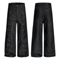 Black wide-leg denim pants with red contrast stitching and symmetrical snap-button scalloped pockets on both legs, front and