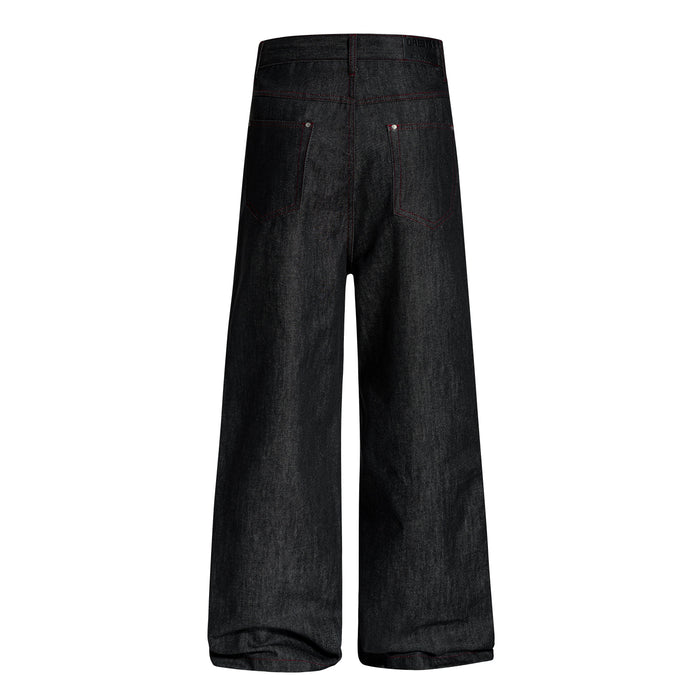 Back view of black wide-leg denim pants with red contrast stitching and rear patch pockets
