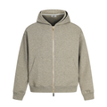 Beige zip-up hoodie with hood, front pockets, and gold zipper on a white background