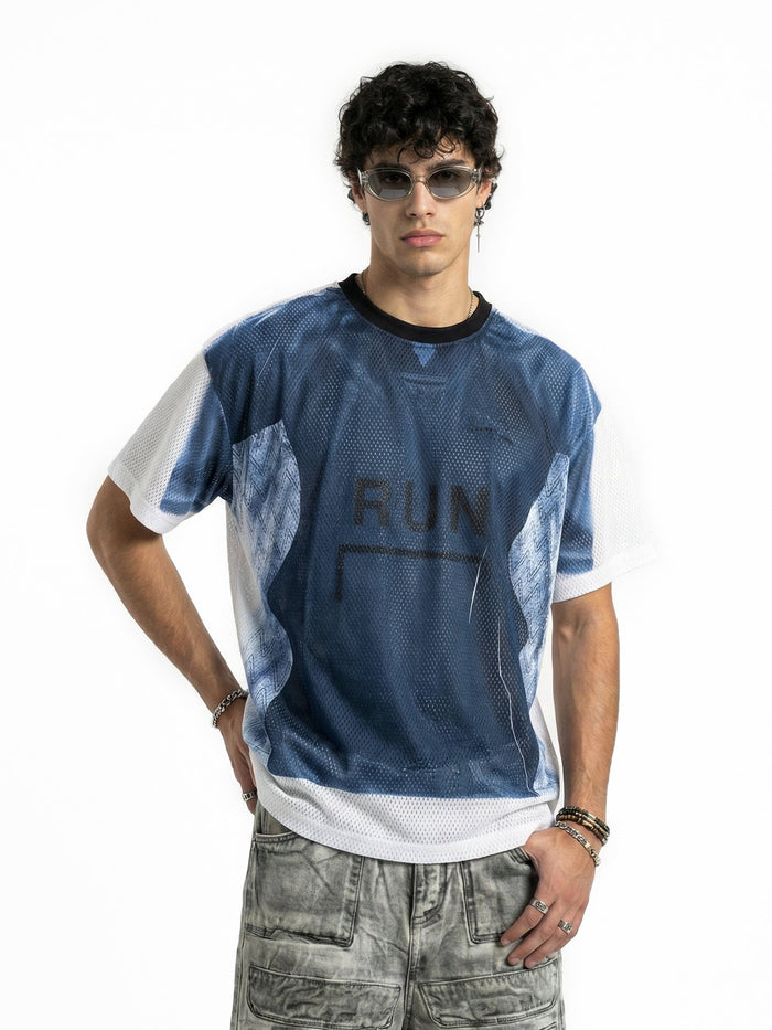 Model wearing a blue and white mesh jersey with RUN graphic, styled with sunglasses and gray cargo pants
