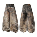 Omirad Savage Pattern Balloon Jeans front and back view showing all-over hybrid animal print on oversized wide leg denim