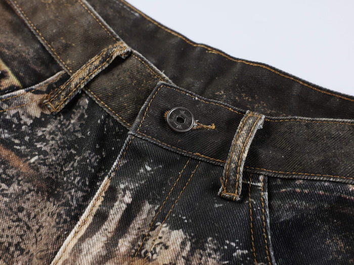 Close-up of waistband button and belt loop on animal print denim