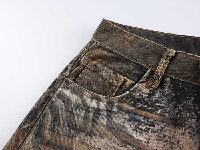 Close-up of front pocket and waistband on brown animal print jeans