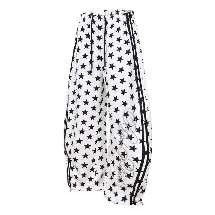 White star print wide-leg sweatpants with striped sides and embroidered script on one leg, angled front view