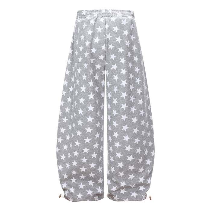 Gray star print wide-leg sweatpants shown from the back, with white side stripes and loose fit