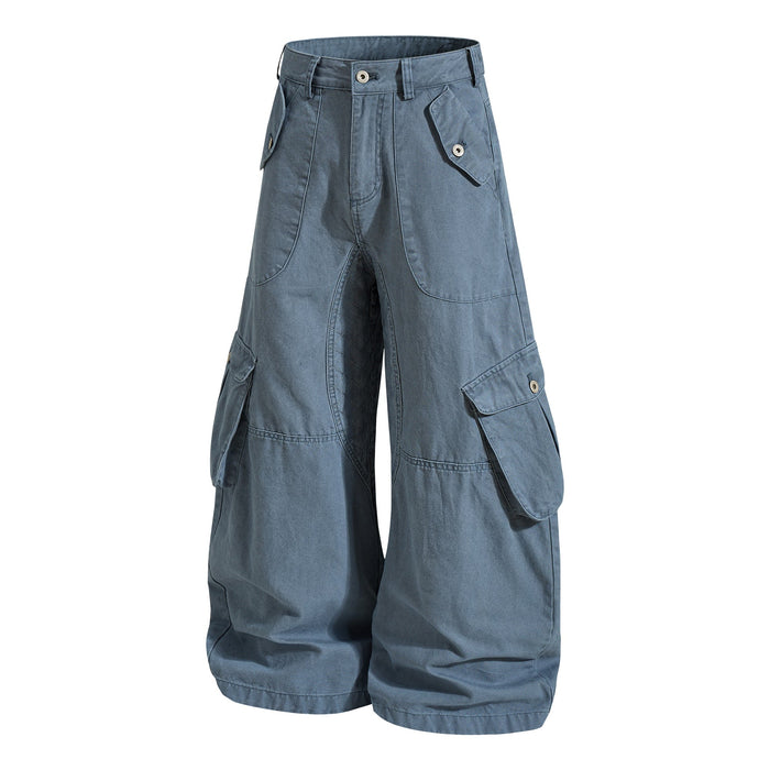 Blue cargo pants front view with quilted inner leg panel and flap pockets