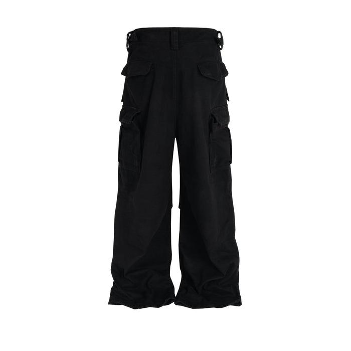 Black cargo pants with flap pockets and buckle waist, back view