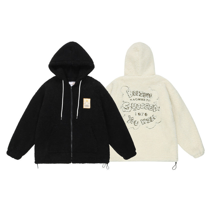 Oversized sherpa fleece zip-up hoodie jacket in black showing front patch and back letter graphic