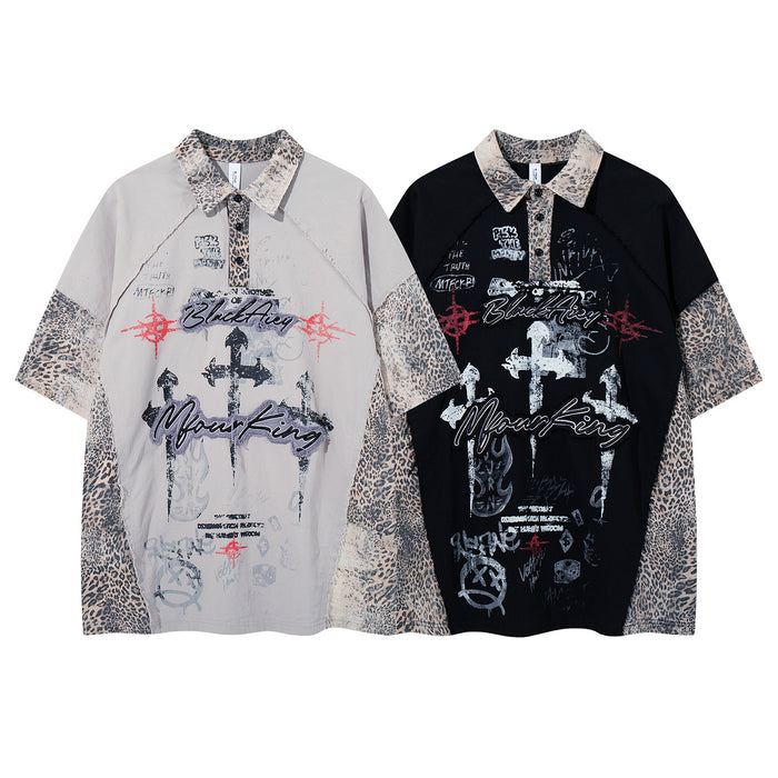 Front view of gray and black collared shirts with leopard-print panels and graffiti-style graphic designs