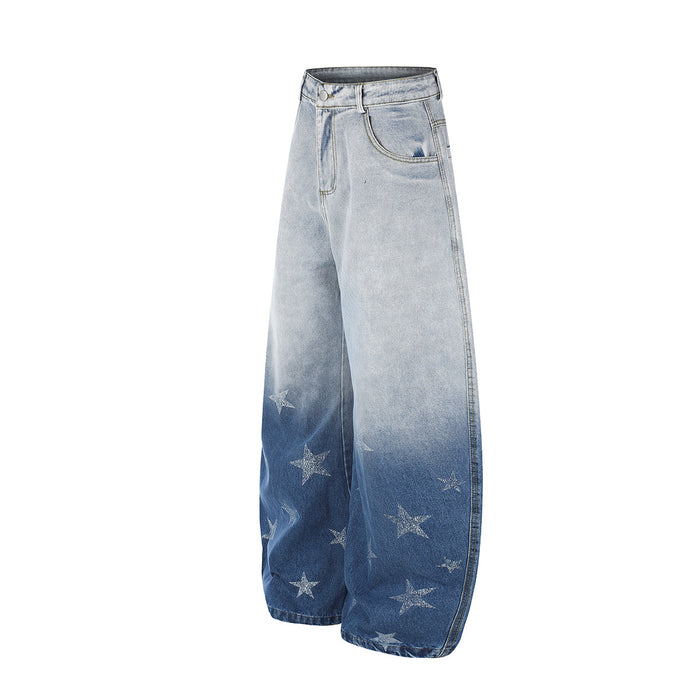 Angled front view of light blue gradient wash wide-leg jeans with star prints near the hems