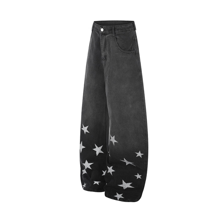 Angled front view of black star print wide-leg jeans showing the curved leg silhouette