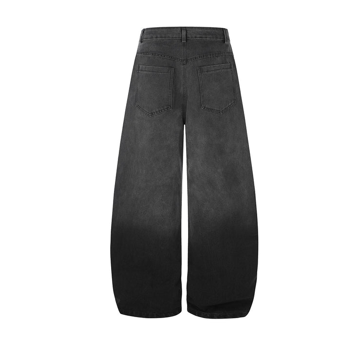 Back view of black wide-leg jeans with plain rear pockets and a darker gradient at the hems