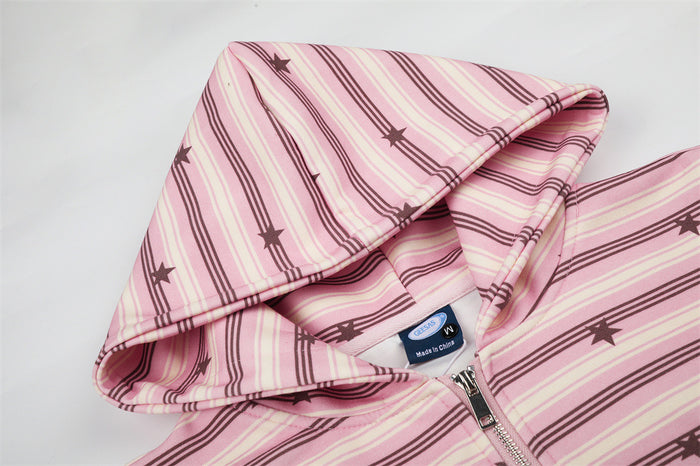 Close-up of the pink star-print hoodie hood, striped fabric, zipper, and sewn-in neck label