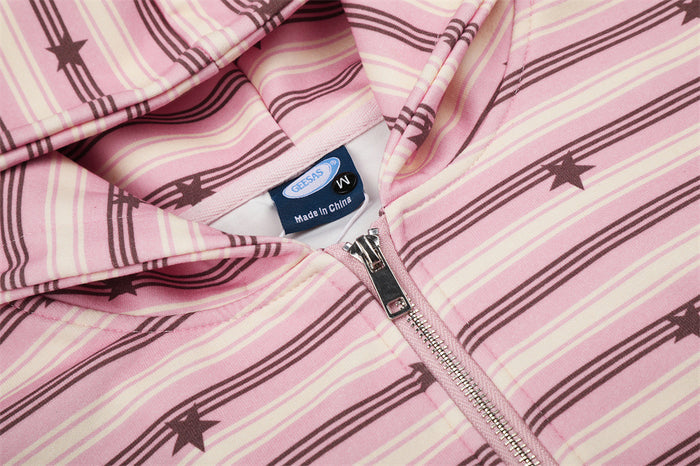 Pink striped star-print hoodie close-up showing the neck label, metal zipper, and hood seam