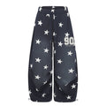 Oversized wide-leg star print sweatpants with pleated front panel and varsity 90 patch in navy blue