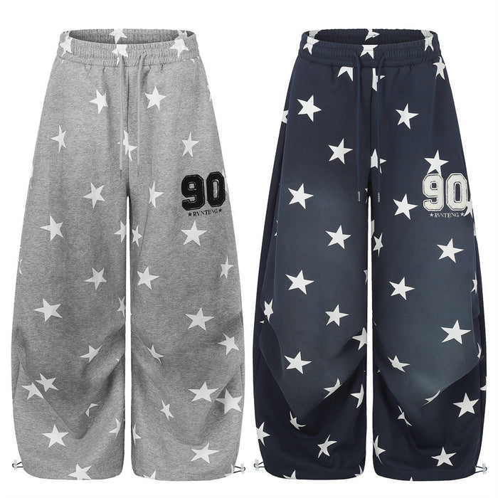 Gray and navy wide-leg sweatpants with white star print, front view