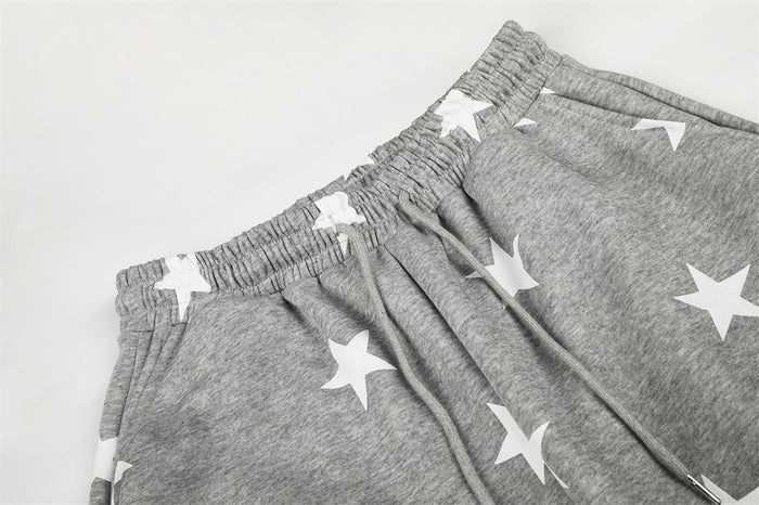 Gray elastic waistband with star print and gathered pleats close-up
