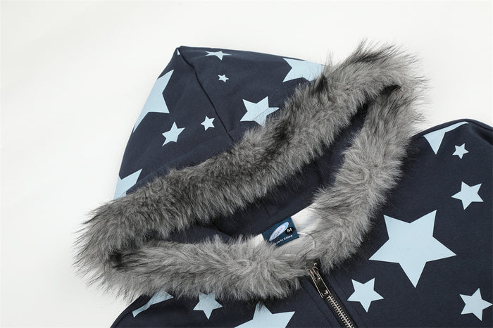 Close-up of the navy hoodie’s star-print hood with thick gray faux fur trim and zipper edge