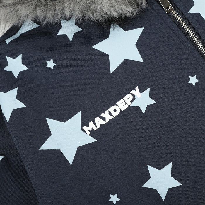 Close-up of pale blue star graphics and white MAXDERY logo on dark navy hoodie fabric