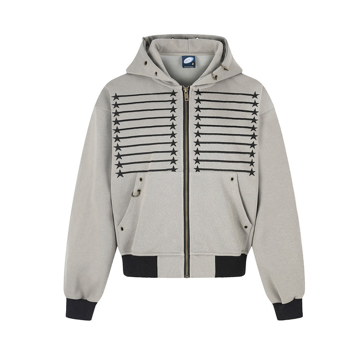 Oversized zip-up hoodie with embroidered star and stripe graphic on chest, brass zipper, metal eyelets, and ribbed black hem